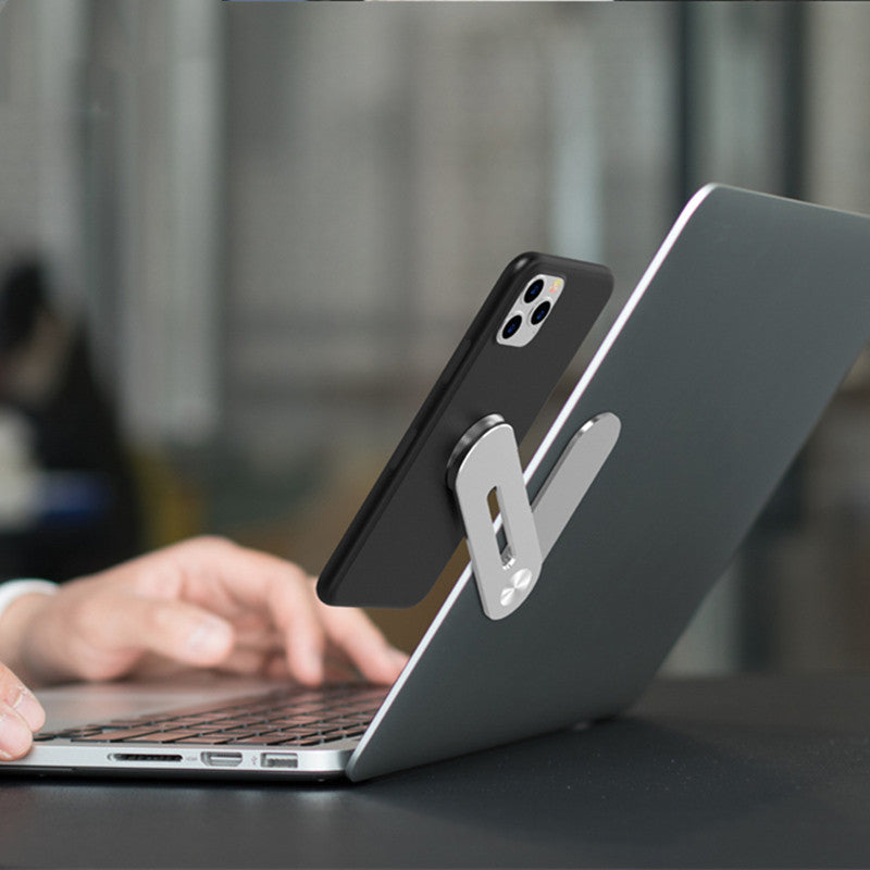 Magnetic laptop phone holder